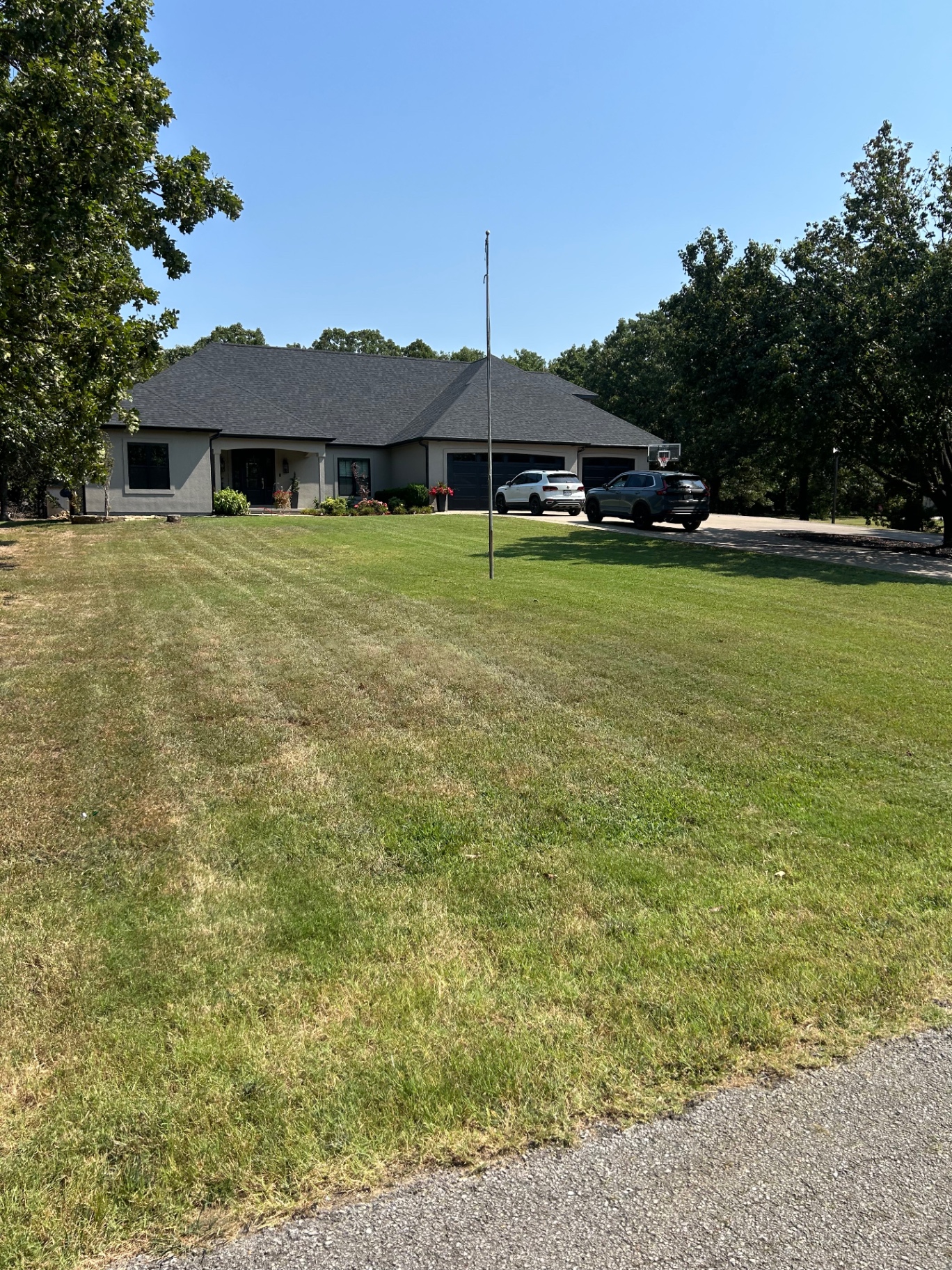 Exterior & Lawn Care — Finished exterior with the lawn cut and edged for clean curb appeal.