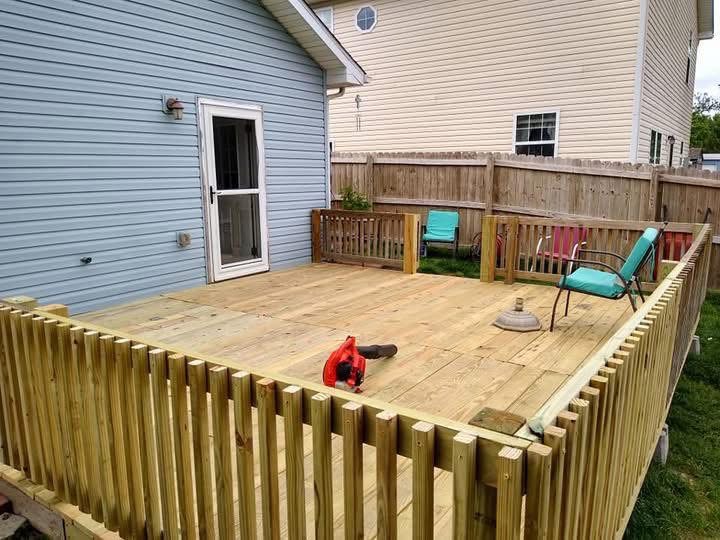 Deck Built In A Day — Full pressure treated deck and picket skirting, framed and decked the same day.